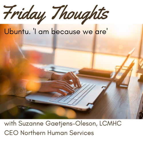 close up of a laptop comuter with hands typing by a window with afternoon sun. Friday Thoughts Ubuntu: 'I am because we are' with Suzanne Gaetjens-Oleson, LCMHC CEO of Northern Human Services